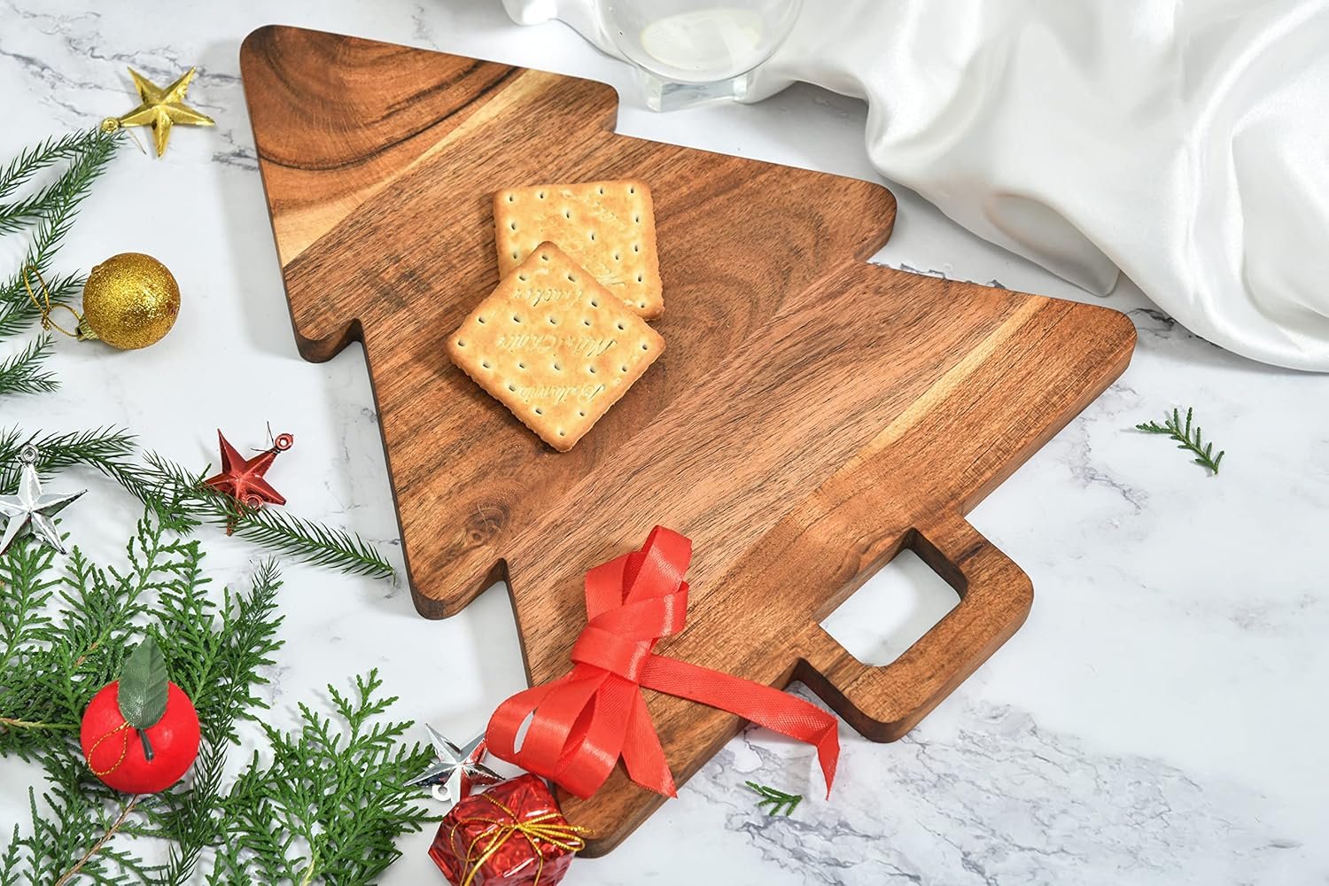 Bamboo wood cutting board shaped like a Christmas tree for holiday serving